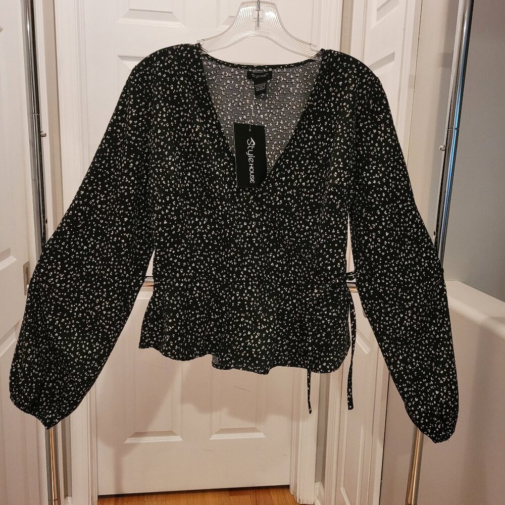 Brand new with tags.  Women's blouse. Black animal print.  Size large.